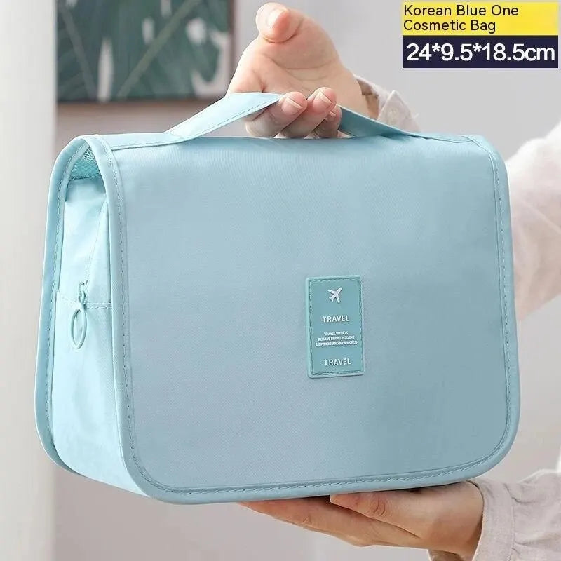 Un sac de voyage multifonctionnel qui peut être suspendu avec séparation sèche et humide, une trousse de toilette et de rangement à main, un ensemble